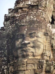 A face made out of stone at Angkor Wat. The Buddhist Temple ruins in Siem Reap