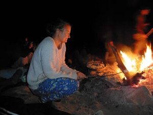 Me roasting marshmallows over on open fire at the King's Canyon campground on the Ayers Rock Tour in Uluru