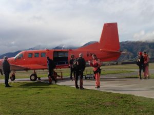 Me and the orange small plane used for Lake Wanaka Sky Dive, in Queenstown, New Zealand
