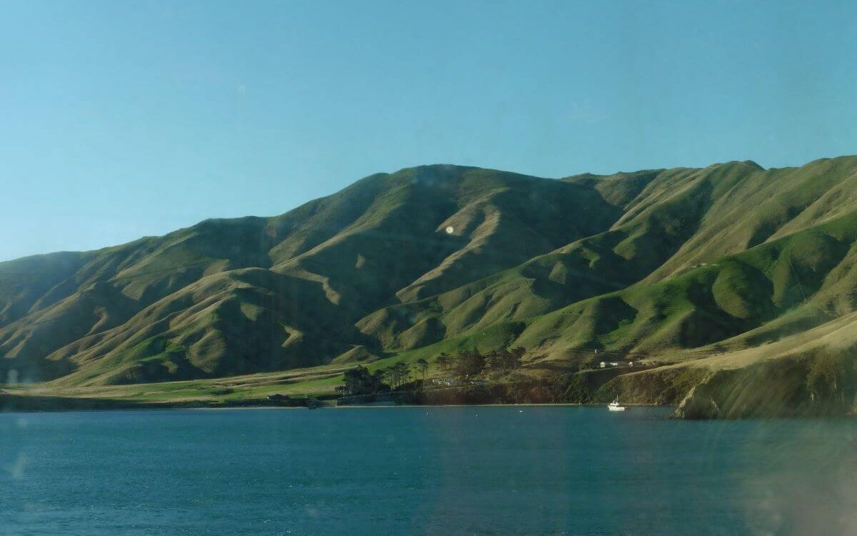 the sea with rolling hills as the backdrop