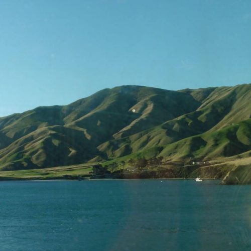 the sea with rolling hills as the backdrop